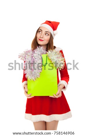 Picture of dreaming woman in costume with new year shopping bag
