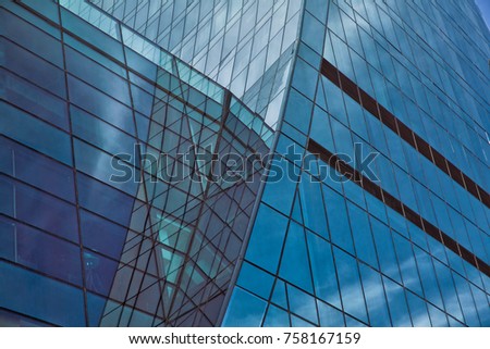 Building glass . Clouds Reflected in Windows of Modern Office Building.