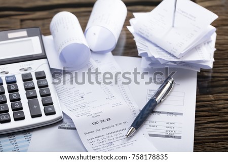 Elevated View Of Calculator And Pen On Receipt In Office Royalty-Free Stock Photo #758178835