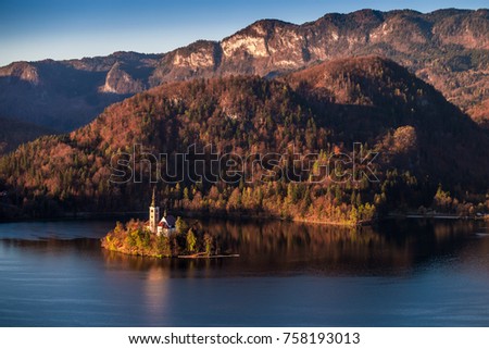 Bled, Slovenia - Beautiful autumn sunrise taken from Bled Castle with the famous Pilgrimage Church of the Assumption of Maria with Julian Alps at background