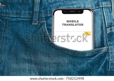 Mobile translator. Smartphone in pocket jeans trousers as a mobile translator.