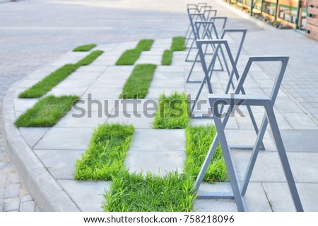 Creative eco bicycle parking with green zones. Healthy lifestyle concept. 