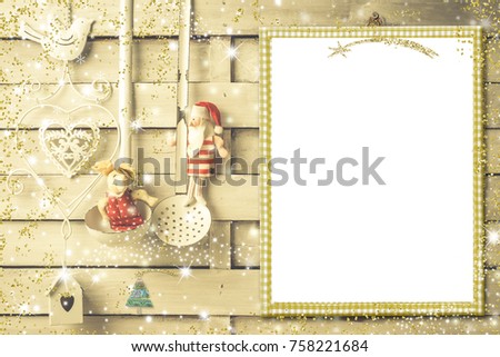 Background for writing the Christmas menu put  photo or greetings, empty picture frame, vintage cooking utensils, Santa Claus and reindeer rag dolls in rustic kitchen