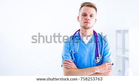 Doctor with stethoscope standing , crossed arms, isolated on white background