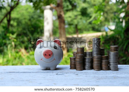 Coins placed on the wooden floor. Against the backdrop of wood,Concept of saving money for future.