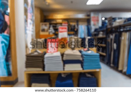 Abstract blurred photo of clothing store in a shopping mall, shopping concept