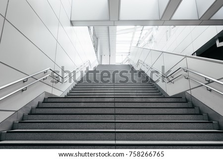Stairs from underground upward in modern city space. Royalty-Free Stock Photo #758266765