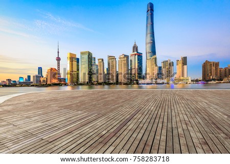 Empty square floor and with cityscape and skyline at sunset in Shanghai,China