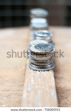 Concept of money saving, financial, Financial, Business Growth concept. Coins are set on a wooden floor.