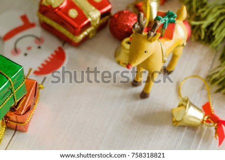 Christmas reindeer bring the gift box to people in Christmas night.