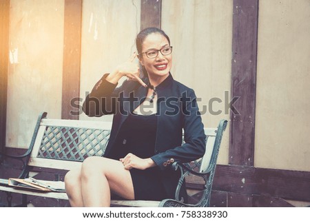 Business happy woman sitting outdoor
