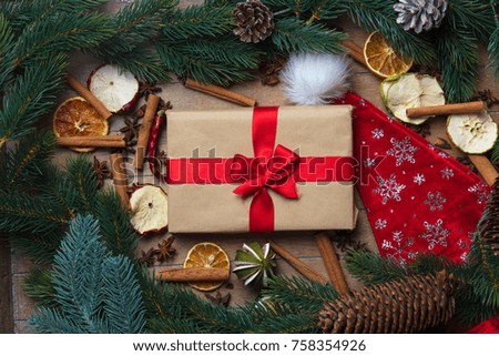Gift box and Christmas decoration, Cinnamon, star anise on wooden background