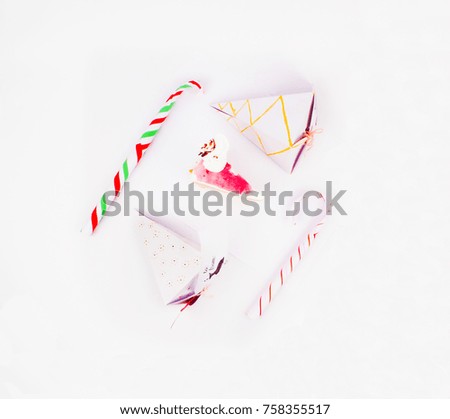 Flat Lay Style Christmas Decoration with cake slice gift boxes with cake piece and candy canes for best background image for Holiday invitations and banners and blogs