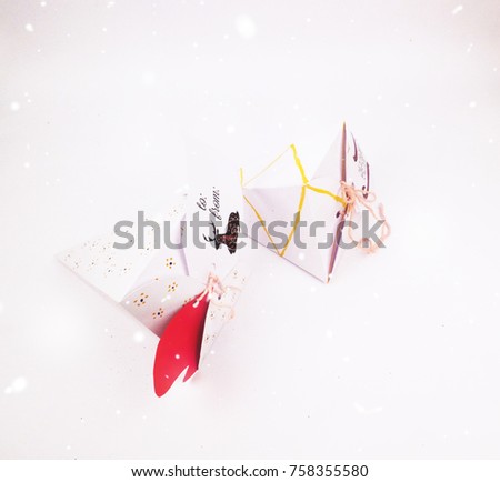 Christmas Decoration with cake slice gift boxes and Lights with snow falling for best background image for Holiday invitation and banners and blogs