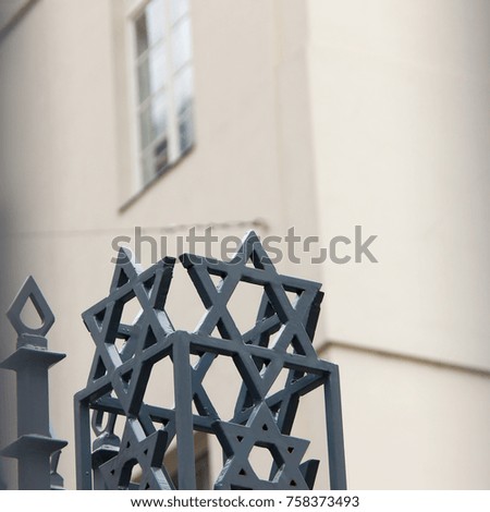 Signs of metal stars of David near at synagogue building