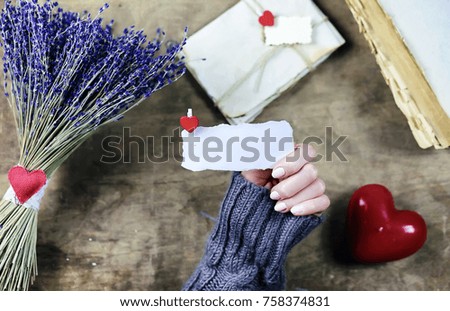 young man gives a girl a bouquet of lavender flowers on holiday