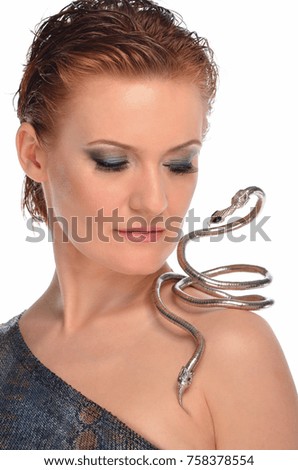 Portrait of a young woman with a decoration in the form of a snake.