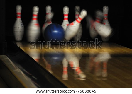 Bowling ball hit pins