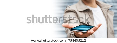Panorama view of a businessman using modern mobile phone on blurred background