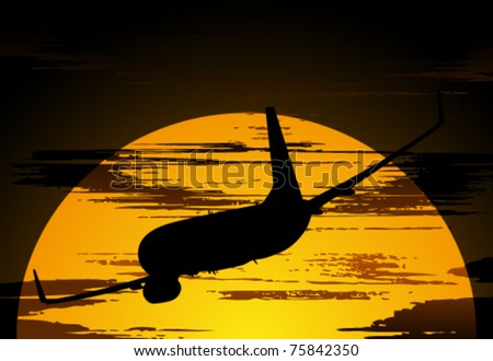 Silhouette of the airliner against the evening sky with clouds