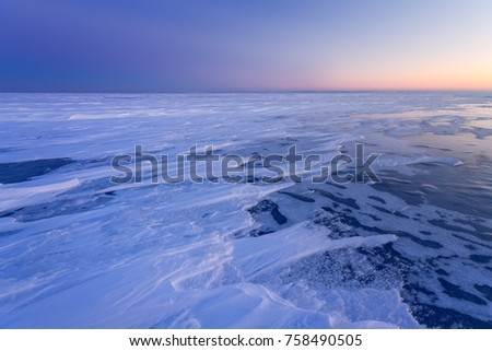 winter landscape just before dawn // dawn over the frozen lake ice landscape