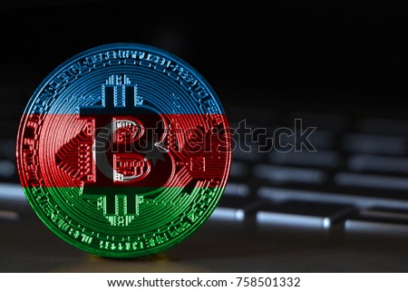 Bitcoin close-up on keyboard background, the flag of Azerbaijan is shown on bitcoin.