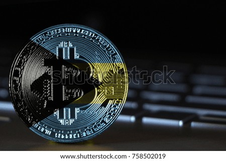 Bitcoin close-up on keyboard background, the flag of Bahamas is shown on bitcoin.