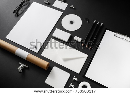 Photo of blank stationery set on black paper background. Corporate identity mockup. Responsive design template. Royalty-Free Stock Photo #758503117