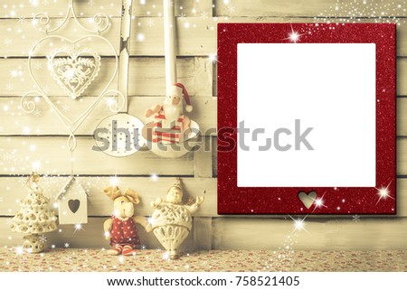 Christmas photo frames cards, empty picture frame hanging on a rustic wall and vintage kitchen utensils, Santa Claus rag doll and xmas decoration.