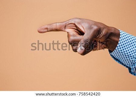 Black male hand point finger. Hand gestures - man pointing on virtual object