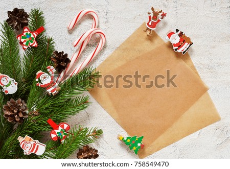 Postcard with decorative clothespins on a white background. New Year background with space for text. Merry Christmas and Happy New Year!