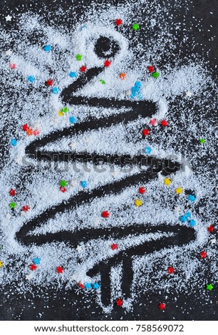Decorative fir of snow with candy stars. New Year's background.