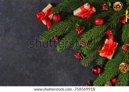 The New Year card is decorated with fir, boxes, ribbons and snow on a black background. Happy New Year and Merry Christmas!