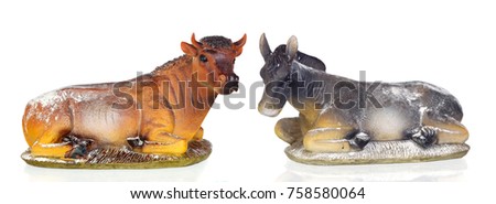 Figures of a ox and a mule for the Nativity Potal isolated on a white background