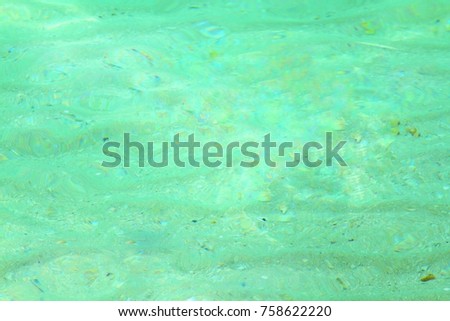 Close up beautiful green sea background or abstract. Tranquil surface texture of the sea.