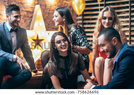 Group of friends enjoying party and having fun. New year, Birthday, Holiday Event concept