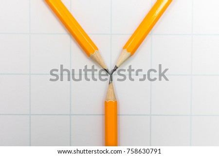 Three yellow pencil on white paper