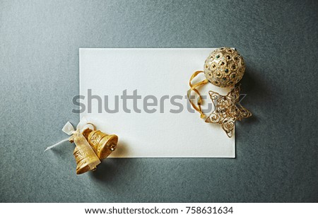 Blank Paper Card with Gold Christmas Decorations; flat lay arrangement