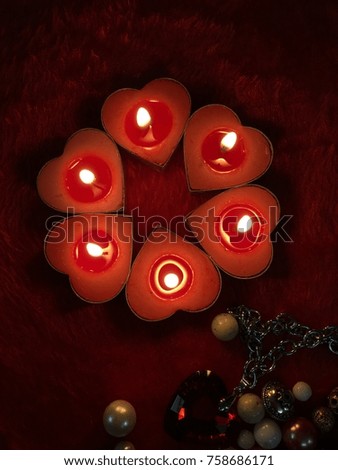 Red Heart background with beautiful heart candles , pearls, shiny heart for valentine’s day