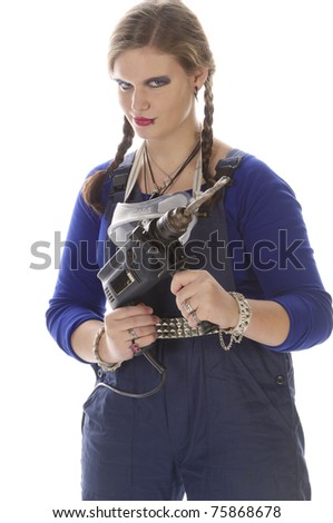 Young female craftsman with lip piercing in a blue work-suit holding tools in her hand, isolated on a white background