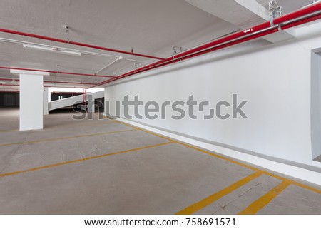 Empty parking garage underground interior in apartment or business building office