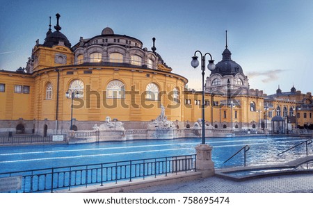 Budapest Spa Szechenyi Thermal Bath swimming pool at sunset Royalty-Free Stock Photo #758695474