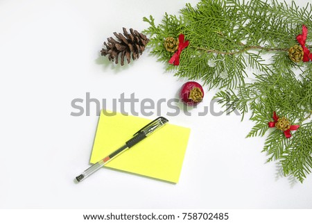 Frame New Year wooden background with red Christmas balls and post it notes isolated on white background