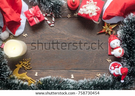 Flat lay image of Christmas decorations & Happy new year ornaments background concept.Free space for creative sign text & font.Many objects on modern rustic brown wooden at home office desk studio. 