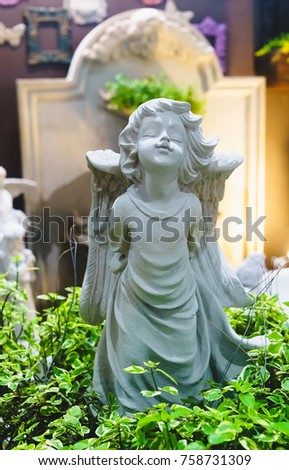 decoration beautiful cute angel statue in garden