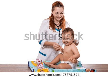 Smiling doctor with small baby isolated on a white background