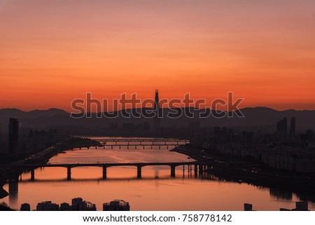 View of the Han River before golden Sunrise and Beautiful sky in Seoul city South Korea.Lotte Tower and Bridge.