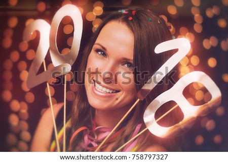Happy new year / Young woman in a new year party Royalty-Free Stock Photo #758797327