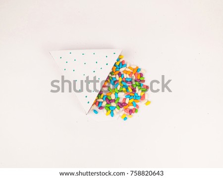 Christmas decoration triangle gift box with colorful candies from the box for celebrations best Christmas holidays background image for invitation