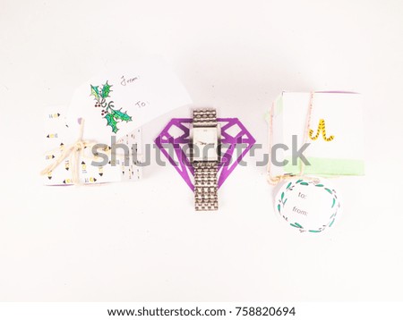 Christmas decoration with square gift boxes with silver watch for celebration best Christmas holidays background image for invitation